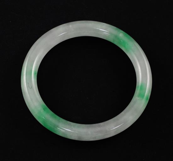 A Chinese ice white and emerald green jadeite bangle, 7.4cm.